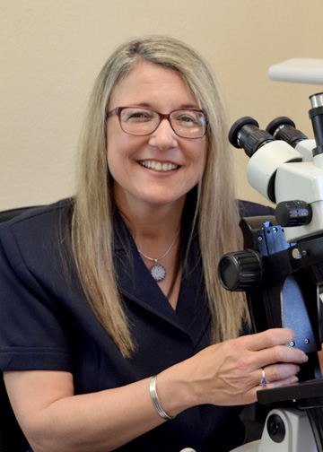 Jeanne at the Microscope